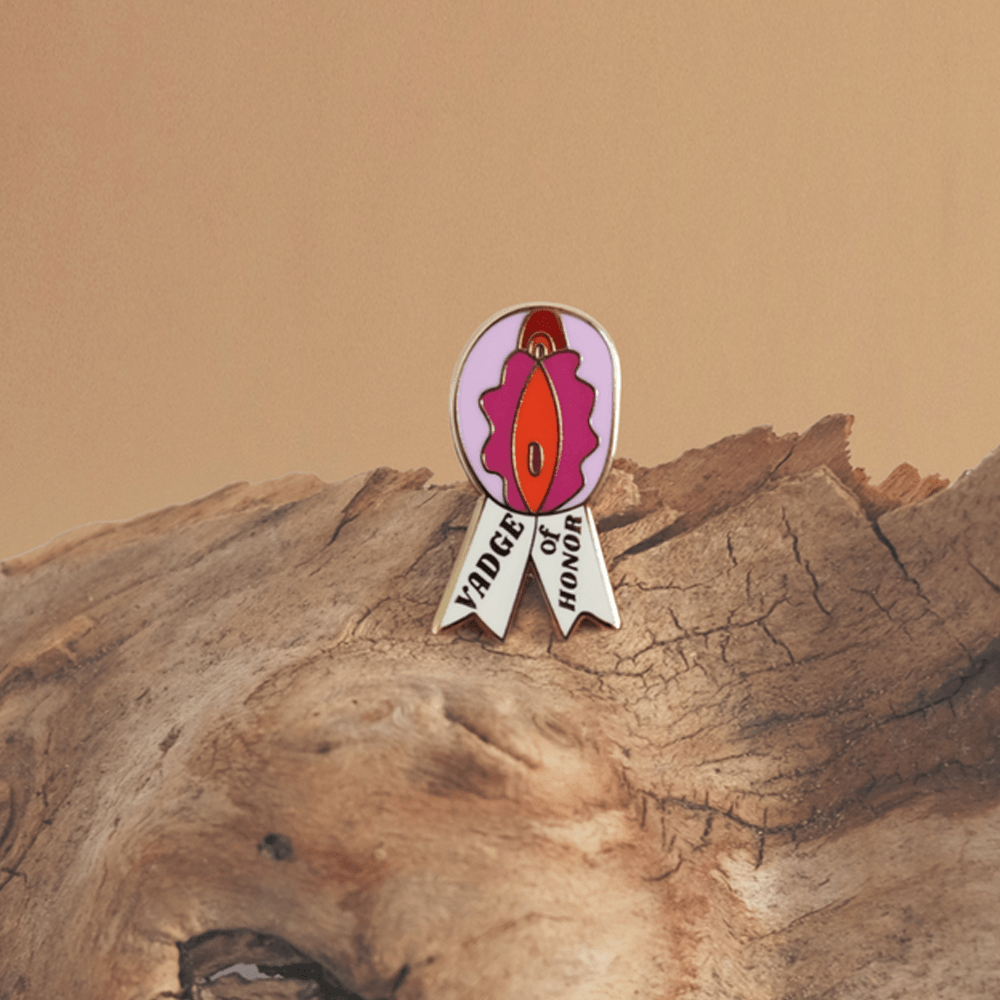 Buy Vadge Of Honor Enamel Pin – Naughtyhut NZ sex toys online. Discreet delivery & top brands.