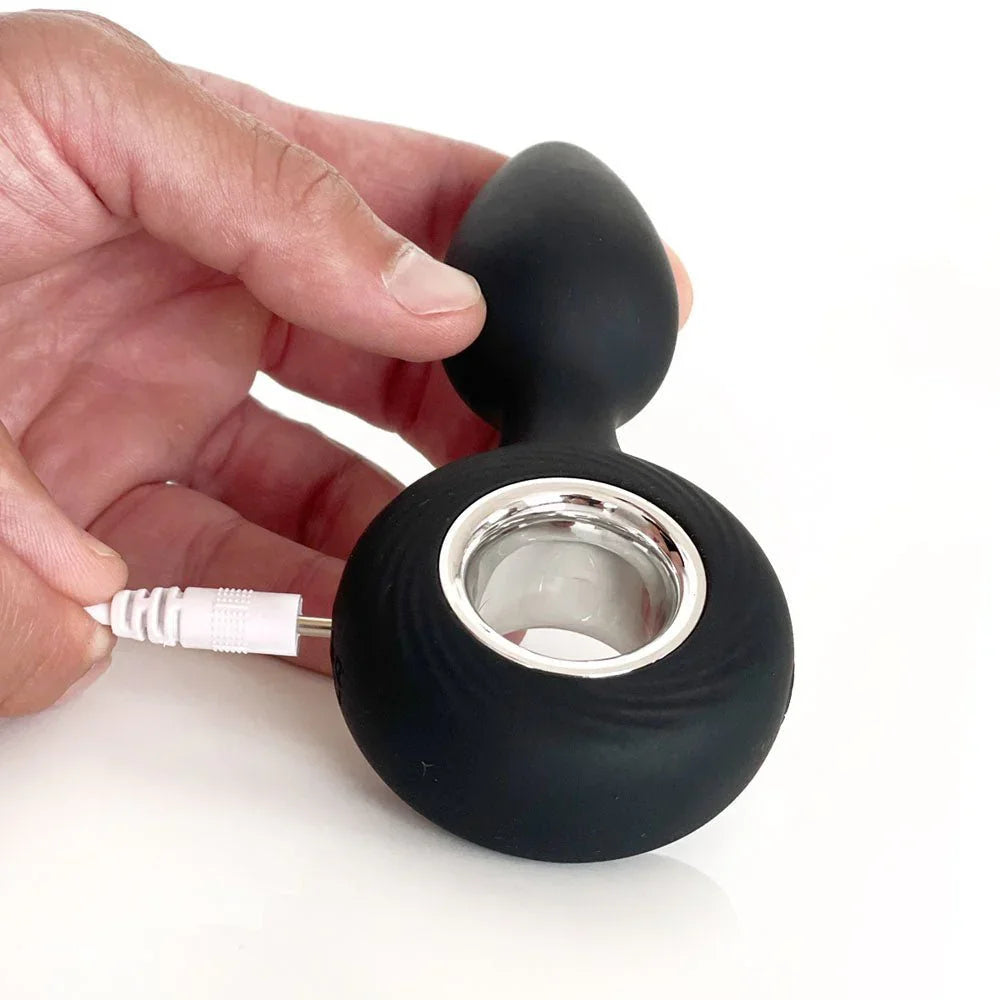 VERS Plug Vibe with the white USB charging pin plugged into the base
