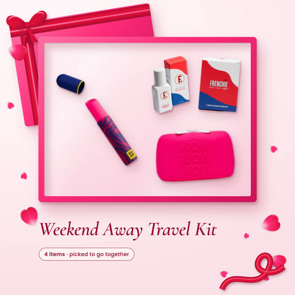 Weekend Away Travel Kit: a Romp Lipstick, Frenchie lube, a pack of wipes and a hot pink zip case on a pink backdrop