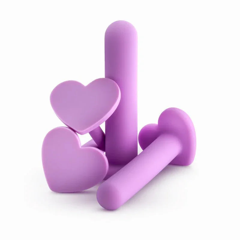 Lilac Wellness dilators stacked in a pile, showing the heart-shaped stopper bases