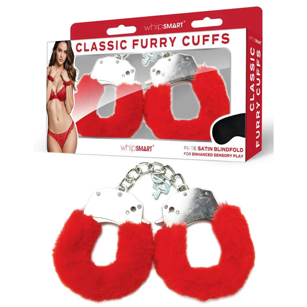 WhipSmart Classic Furry Cuffs in Red laid in front of their retail box
