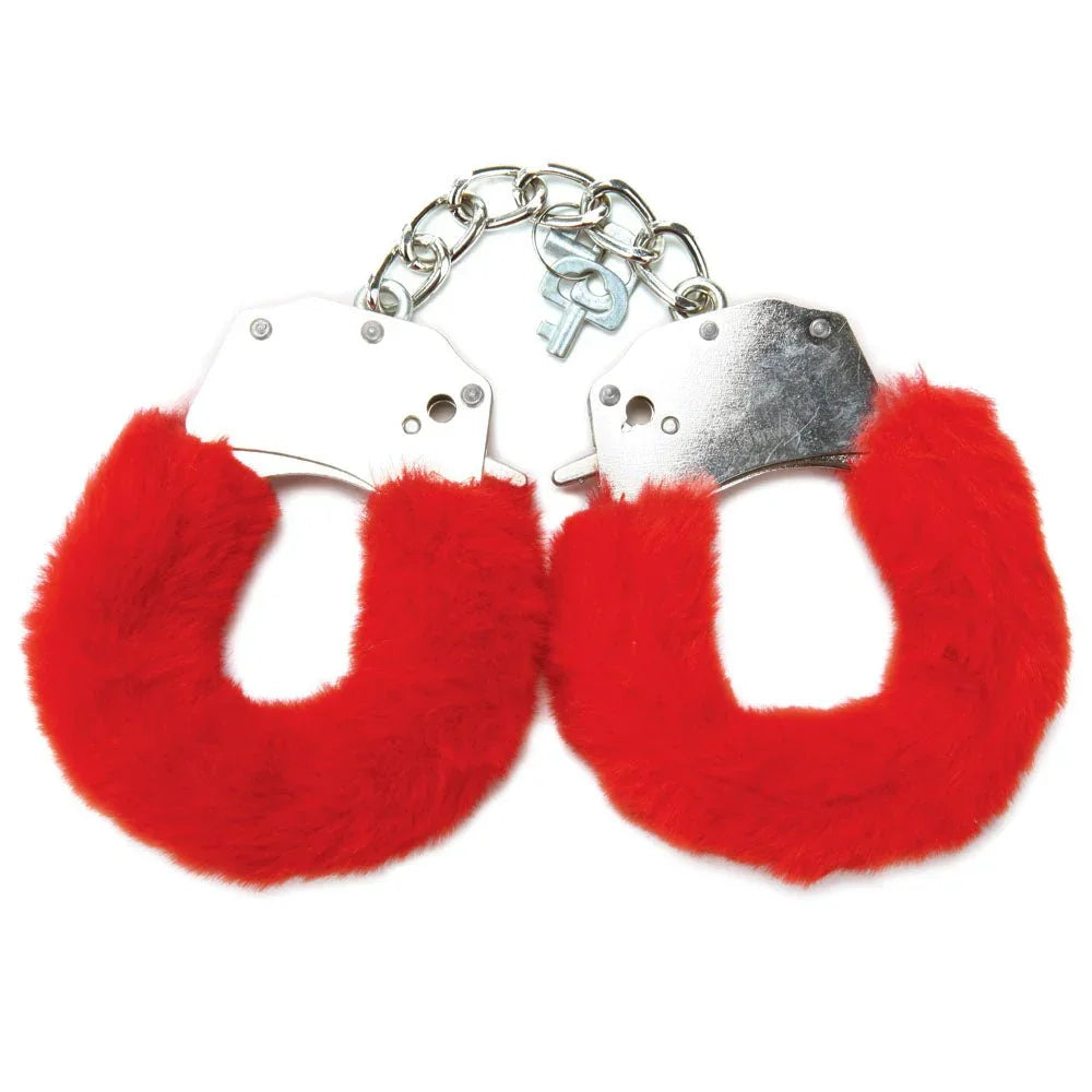 Red furry handcuffs alone on white, chrome cuffs with two keys on the chain