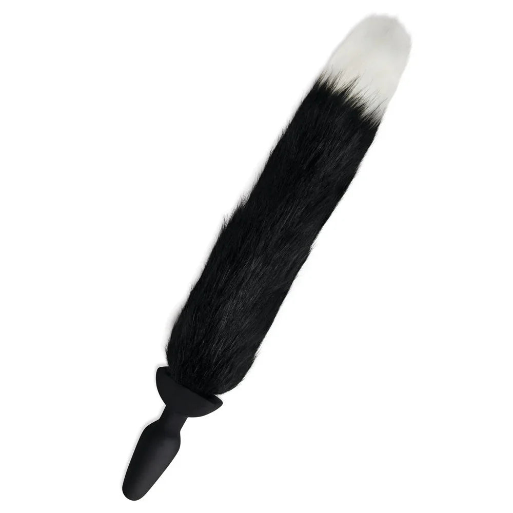Black foxtail with a white tip standing upright, black silicone plug at the base