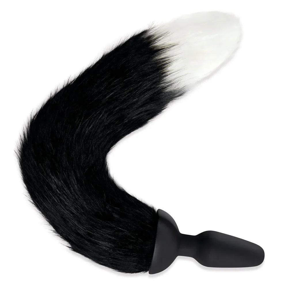 Black and white foxtail curled into a hook on white, silicone plug at the base