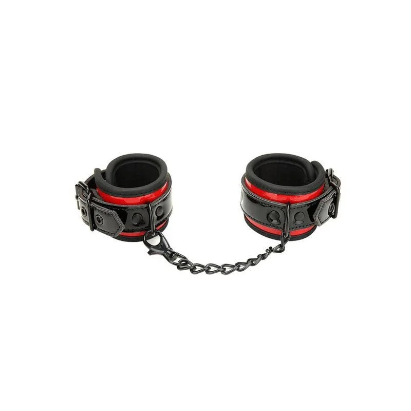 Heartbreaker buckle cuffs in black and red on white, joined by a black chain