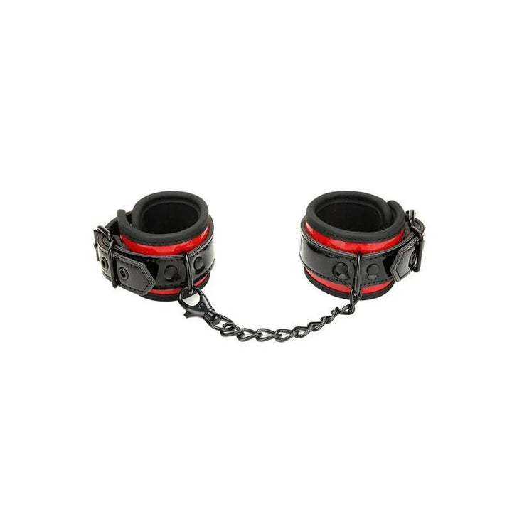 Heartbreaker buckle cuffs in black and red on white, joined by a black chain