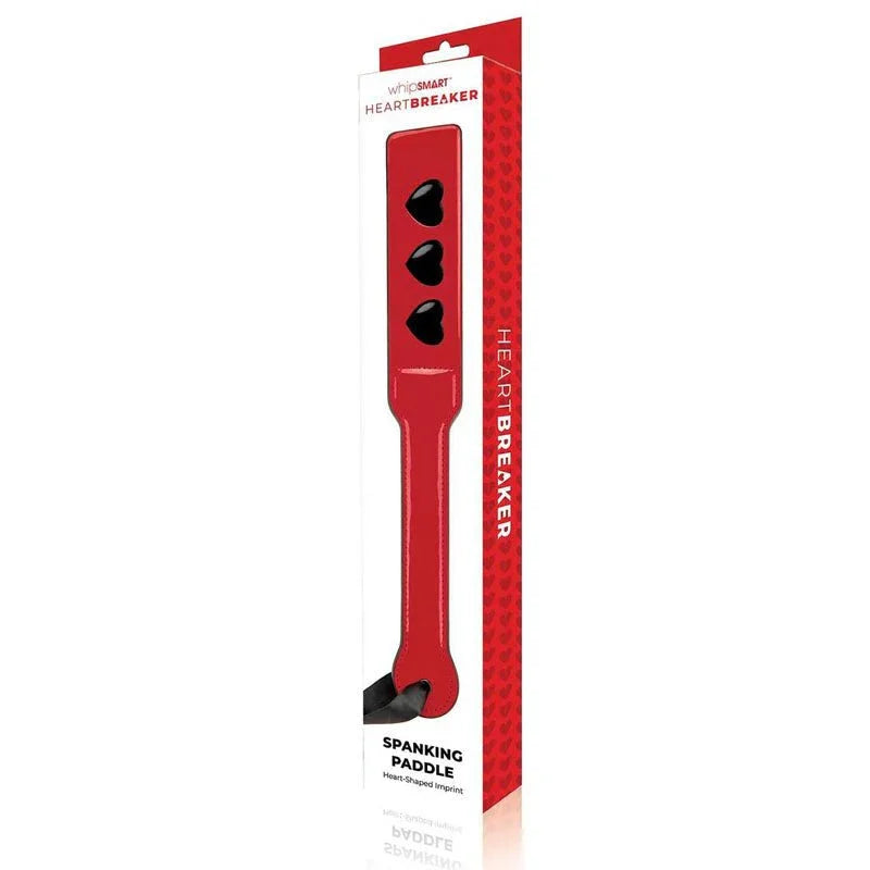 WhipSmart Heartbreaker Spanking Paddle in its red retail box, heart cut-outs visible