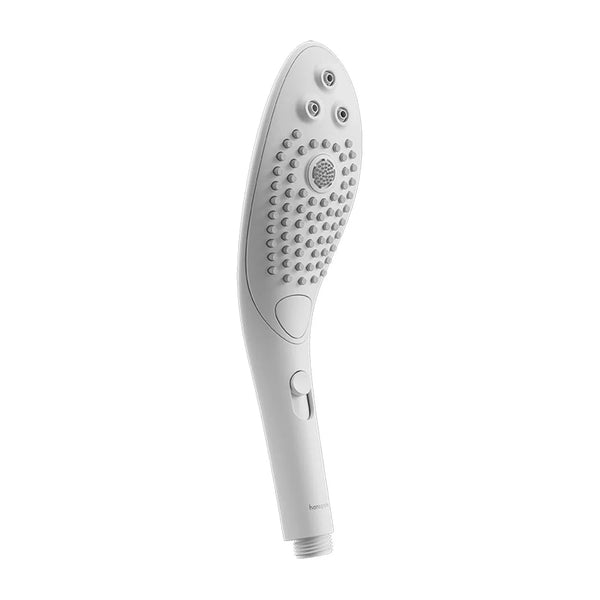 Womanizer Wave shower head in White, textured spray face with control switch