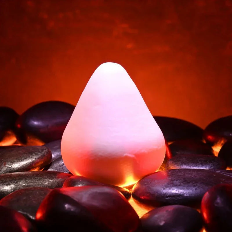 Fuji white cone-shaped stroker standing upright on dark stones