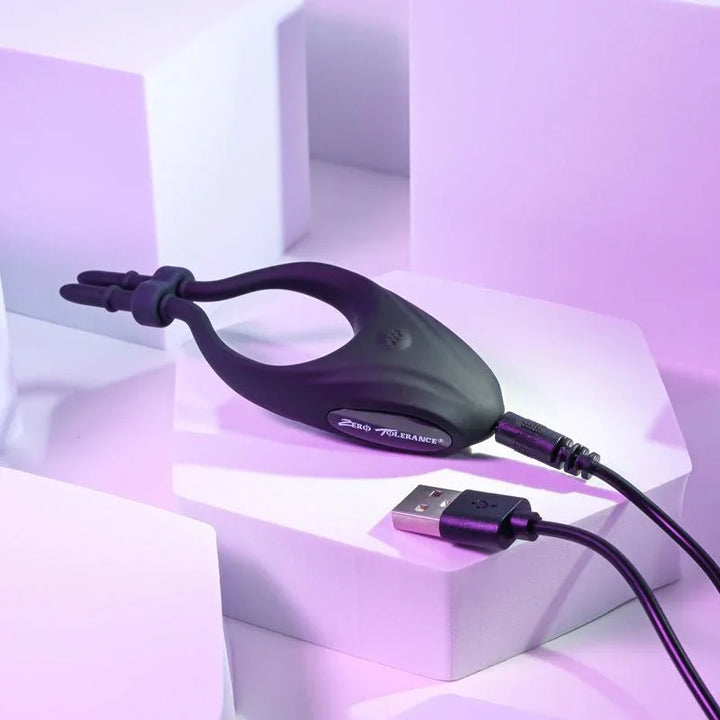 Perfect Fit lasso cock ring with its USB charging cable plugged into the contacts