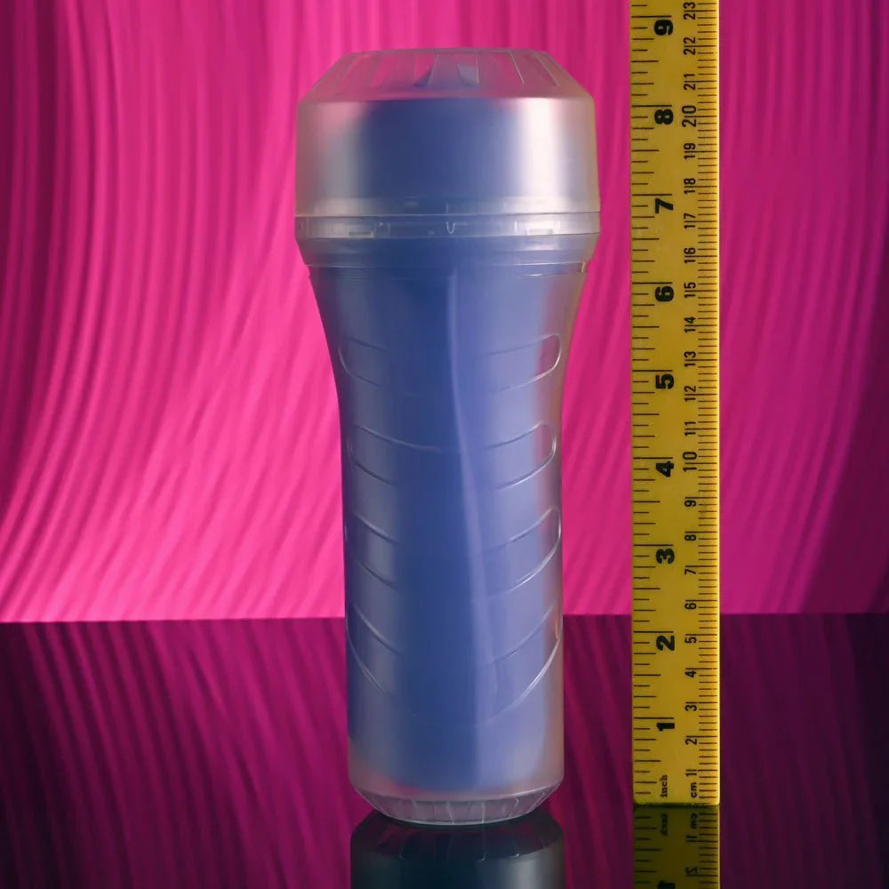 Pop On The Glow stroker stood beside a ruler to show its length