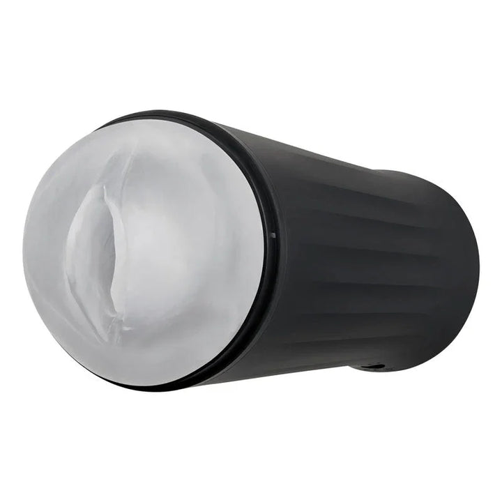 The clear vaginal sleeve seated in the black stroker case, opening upward