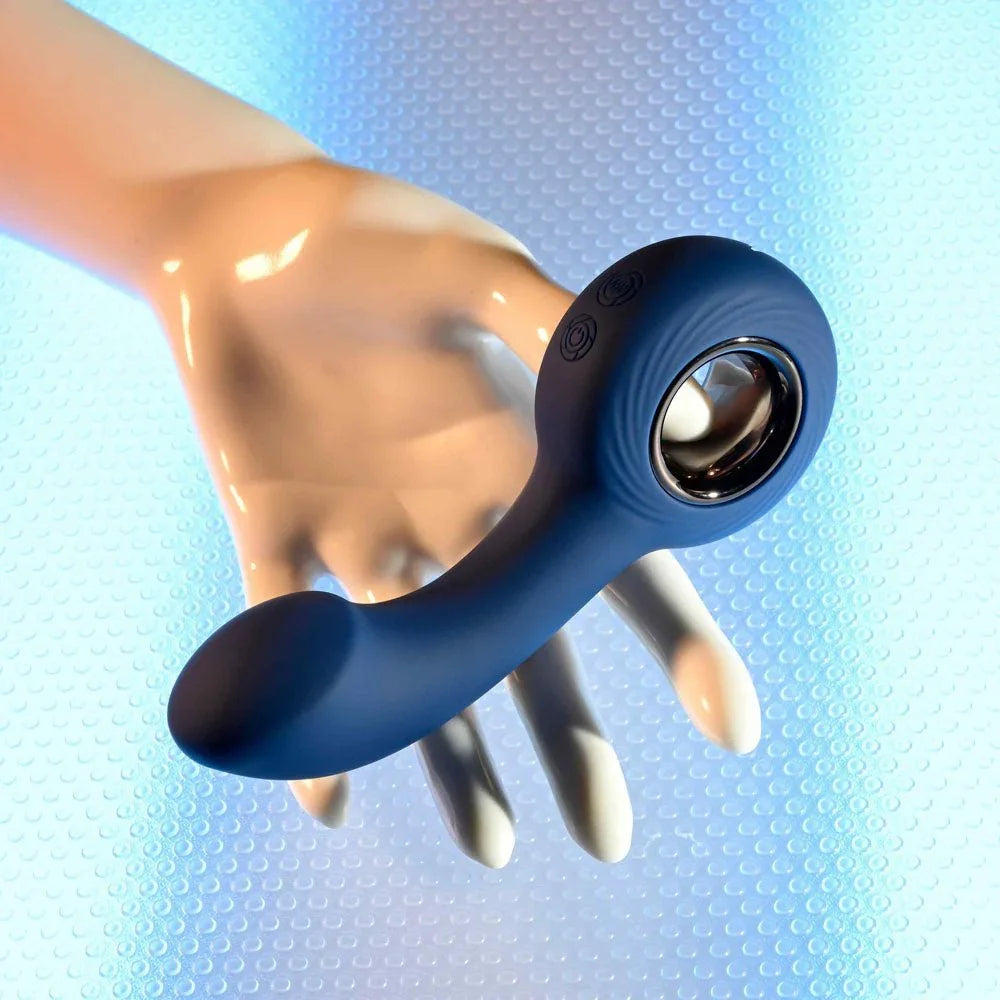 The Reach balanced across a white hand form to show its size