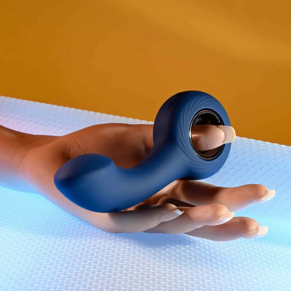 The Reach held by its ring handle on a hand form