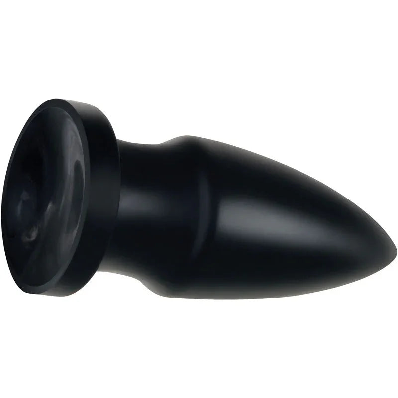 The Titan plug lying on its side with the flared suction base toward the camera