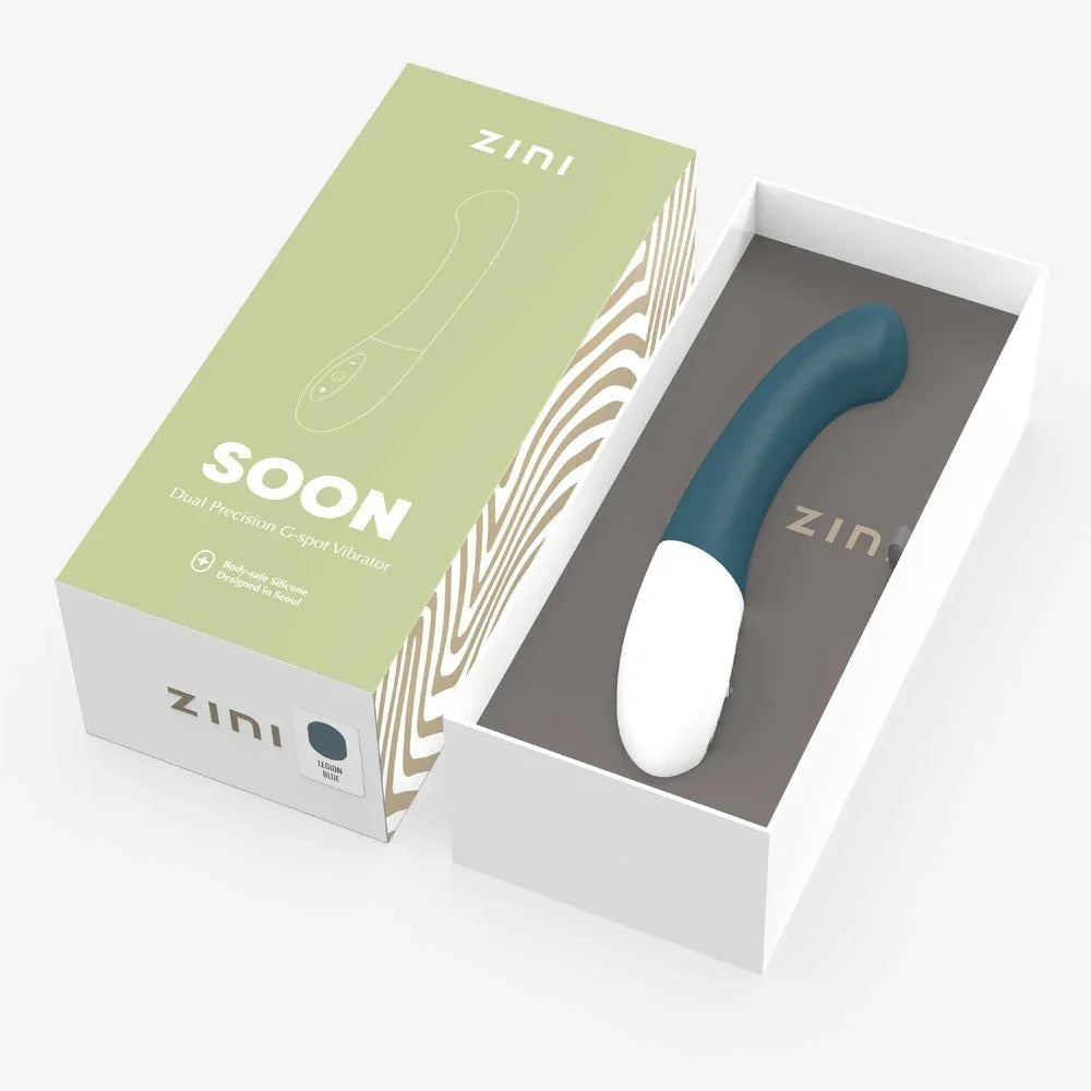 Zini Soon in its opened gift box beside the sage lid