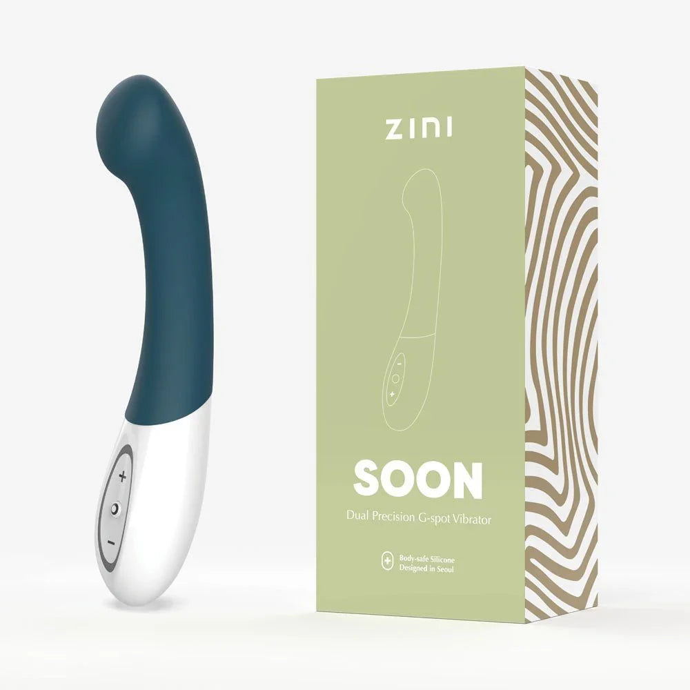 Zini Soon G-spot vibrator in Legion Blue beside its sage-green box