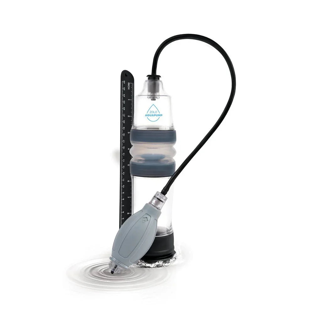 Zolo Aquapump Compact in Clear upright against its inch and centimetre gauge strip