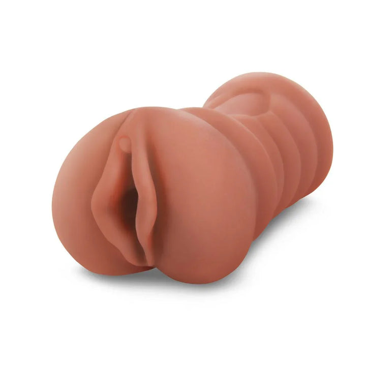 Zolo Stroke Off Latina Pussy Stroker in Tan, angled close-up of the sculpted vulva opening