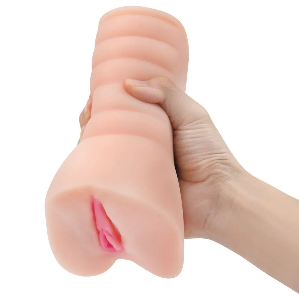 Zolo Stroke Off Virgin Pussy Stroker squeezed in a hand, ribbed outer body compressing