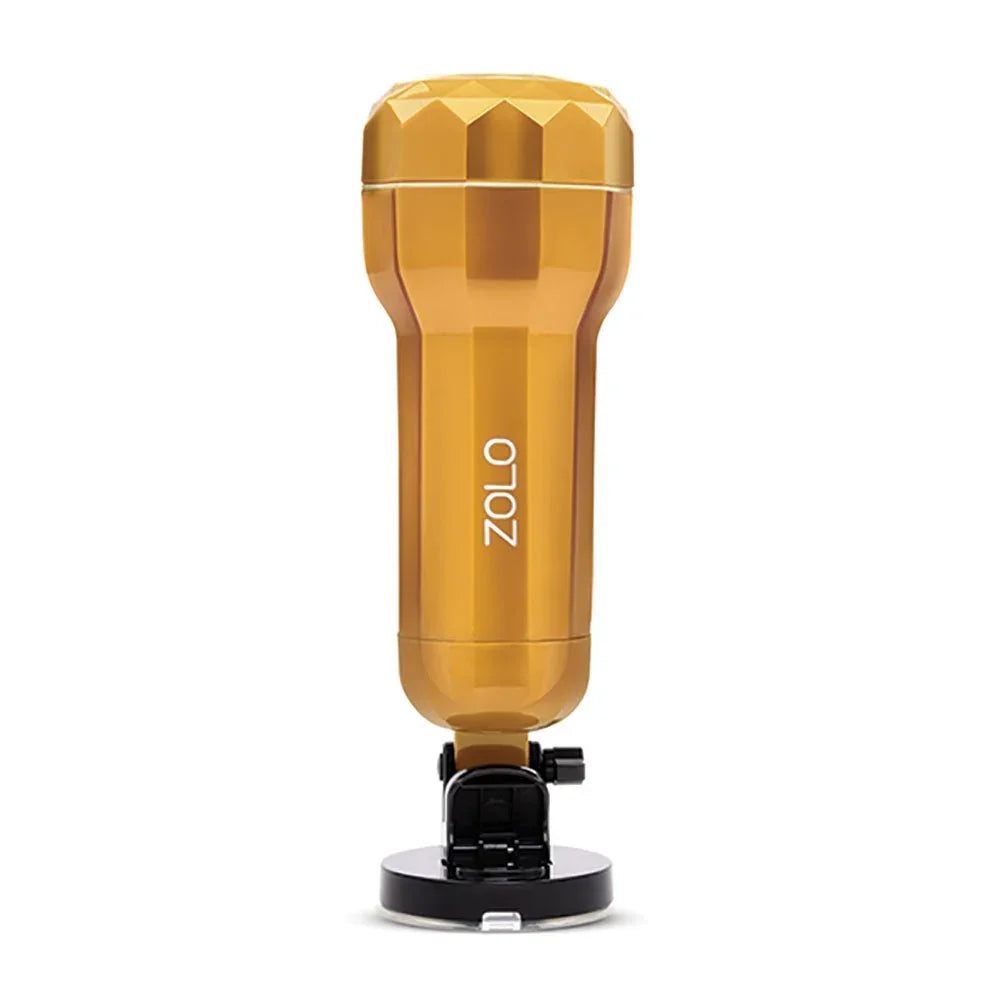 Zolo Vibrating Personal Trainer standing upright on its black suction base, gold case
